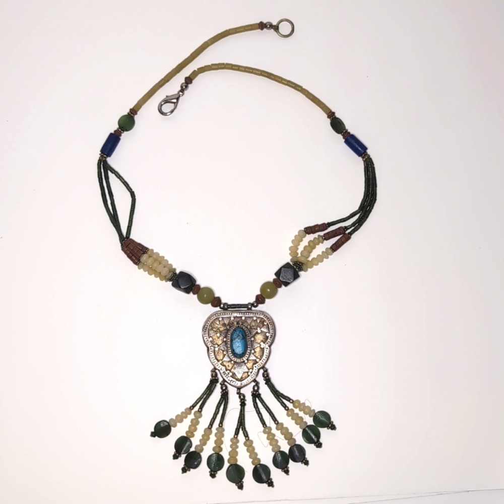 Beaded necklace with silver content centerpiece